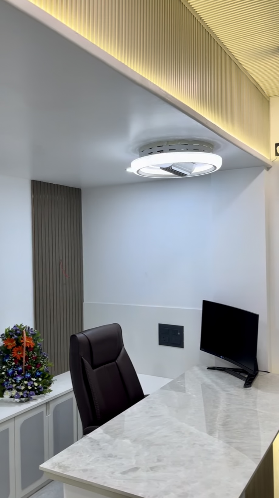 Executive cabin with marble desk and curved monitor